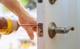 lock being installed on house door