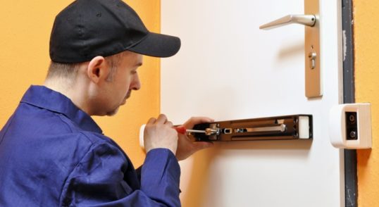 locksmith inspecting property security systems