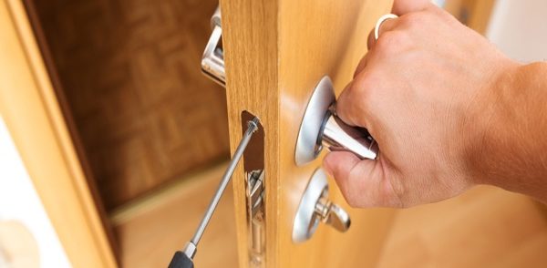 locksmith repairing home security