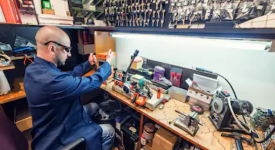locksmith using security products in his workshop