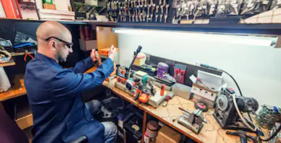 locksmith using security products in his workshop